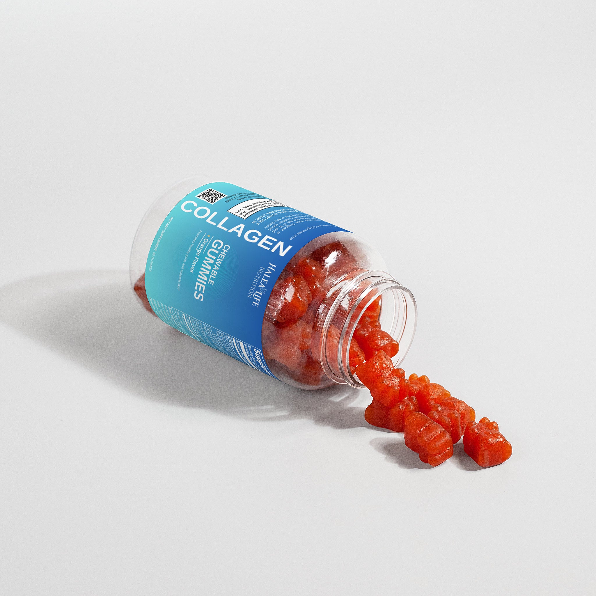 Collagen gummies spilling out of a blue-labeled jar on a white background