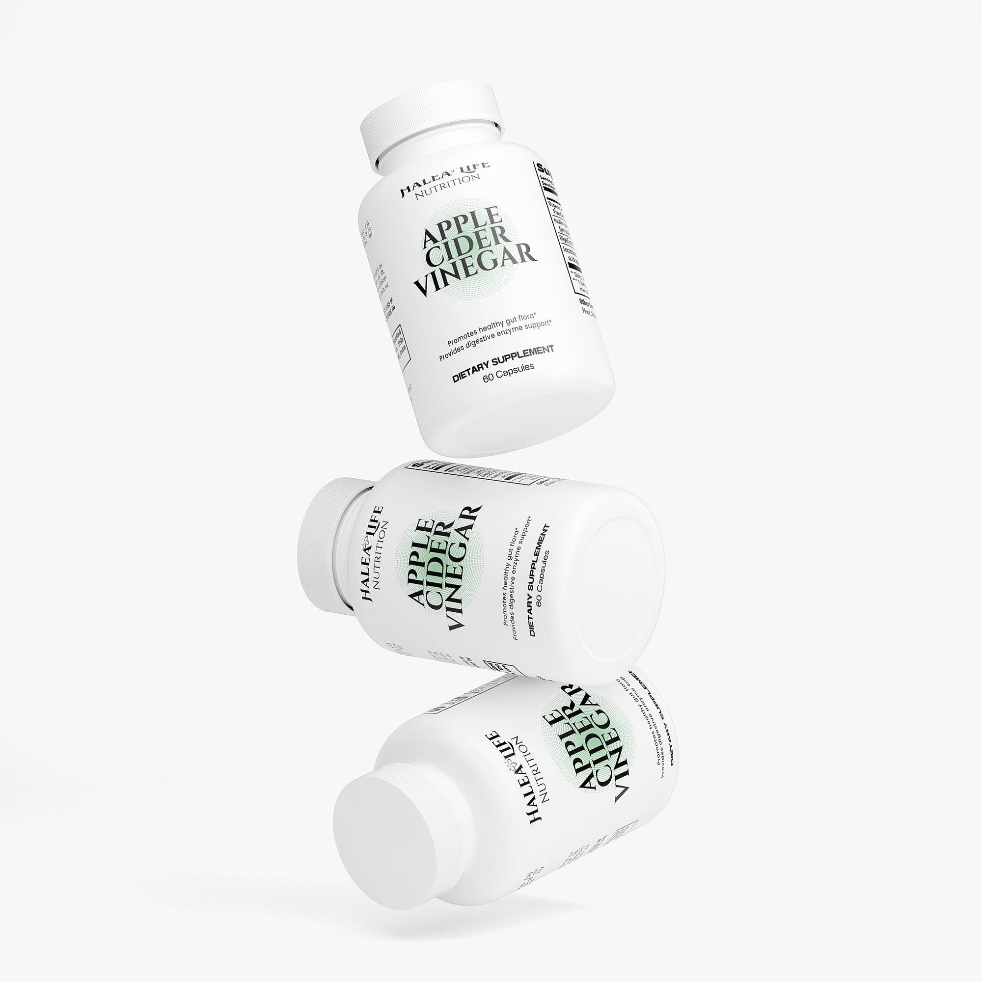 Three bottles of Apple Cider Vinegar on a white background