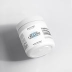 White container of Halea Life Nutrition 100% Pure Creatine Monohydrate on a light gray background