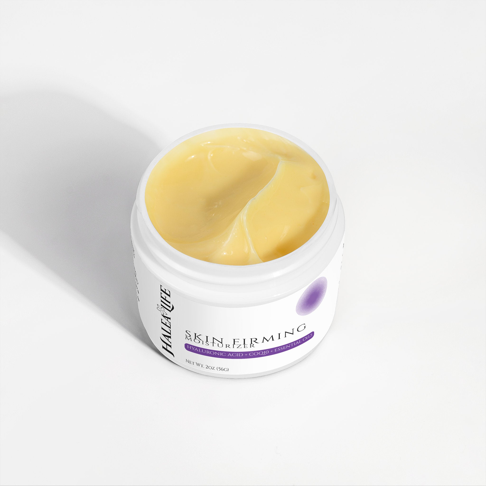 Jar of skincare cream with a white background
