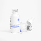 Snail mucin face serum bottle with dropper on a white background