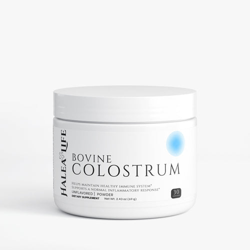 Jar of Bovine Colostrum powder on a white background