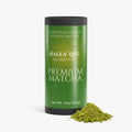 Green container of Halea Life Nutrition Premium Matcha with matcha powder on a white background
