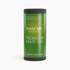 Green canister of Halea Life Nutrition Premium Matcha on a white background