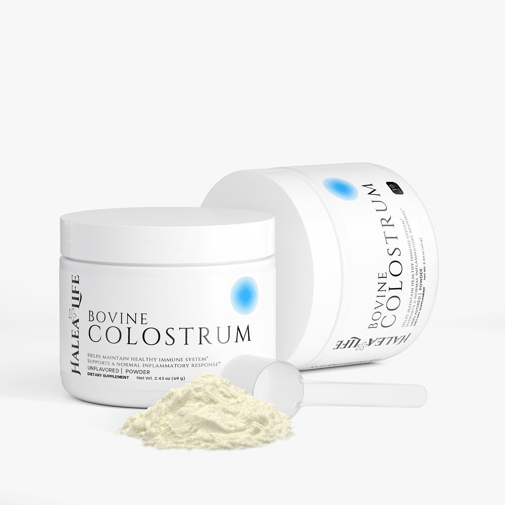 Jar of bovine colostrum powder with open lid on a white background