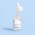 Bottle of Halea Life hyaluronic acid serum with dropper on a light blue background