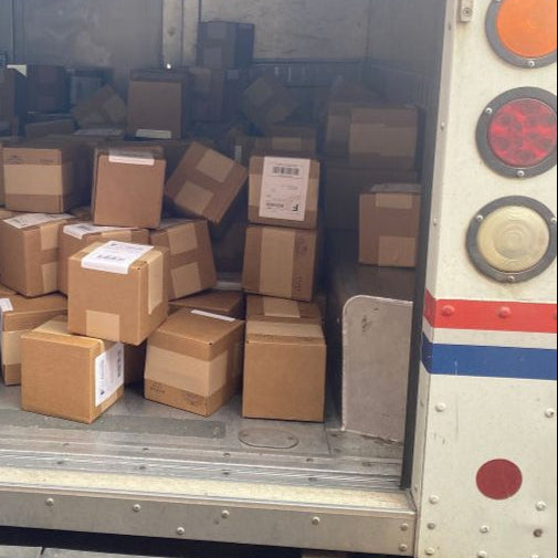 Back of a van filled with cardboard boxes