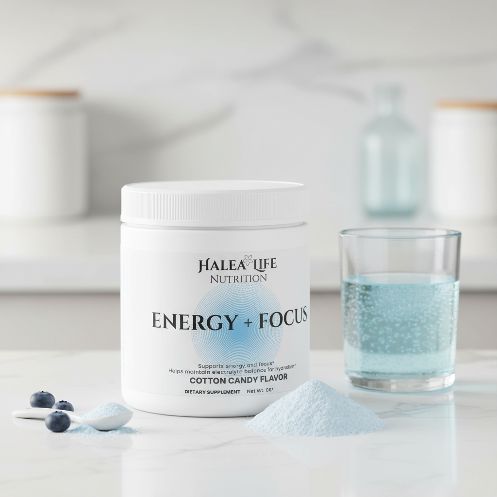 Halea Life Nutrition Energy + Focus supplement jar with a glass of blue liquid on a light background